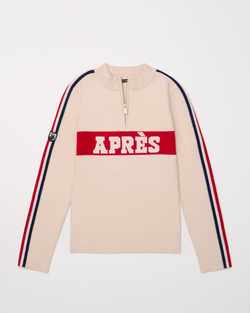 Beige half-zip merino ski sweater with red 'apres' lettering and stripes on sleeves. 