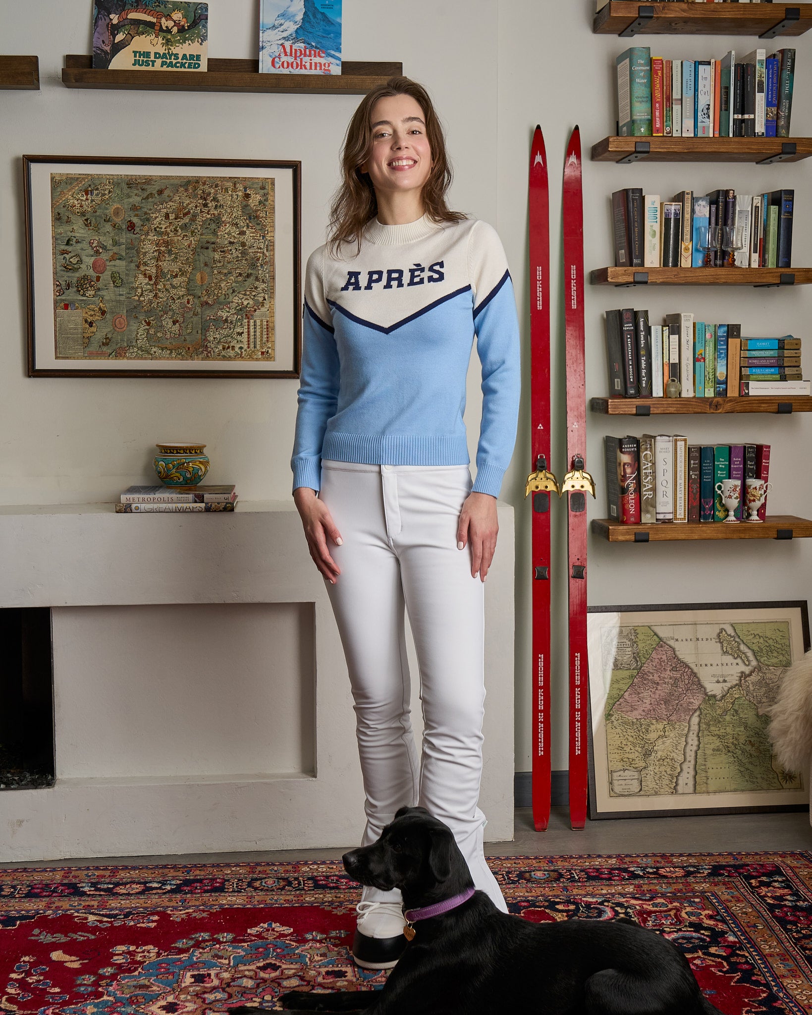 Woman in a blue and white merino ski sweater with 'APRES'