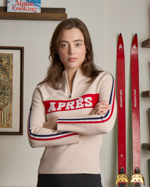 woman wearing preppy beige apres ski sweater in merino