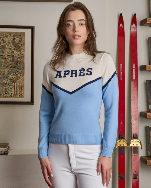 Woman wearing an apres ski sweater in the style of cheerleading